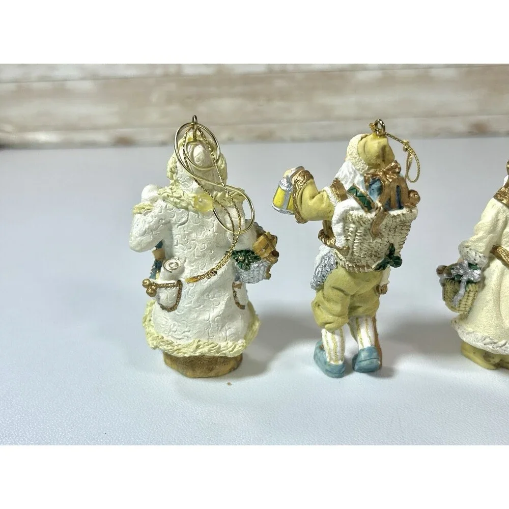 Lot of 4 Santa Figures Christmas Ornaments White Cream Gold Coats Decor